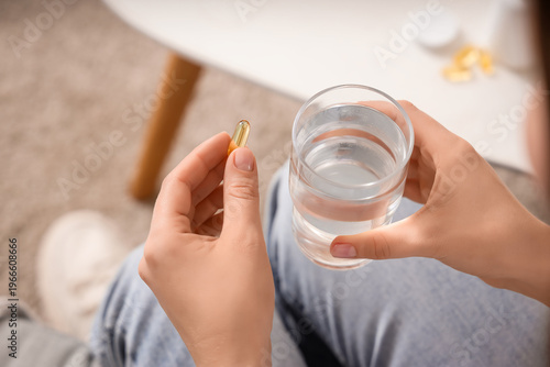 Young woman with glass of w...