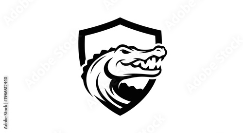 Black and white vector illustration of an alligator head inside shield emblem