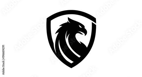 Black eagle silhouette inside shield graphic for logo and design elements