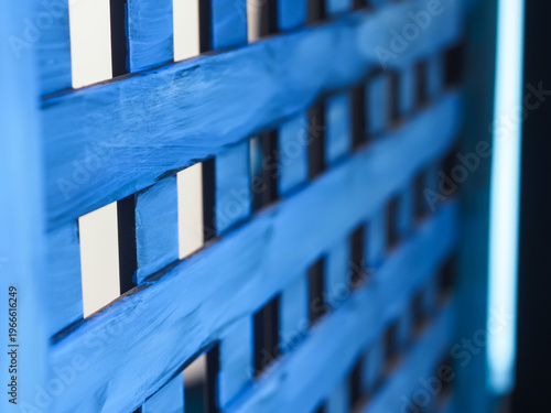 Abstract close-up of a blue wooden partition with elegant vertical lines. A versatile backdrop providing ample copy space for creative branding and lifestyle storytelling.