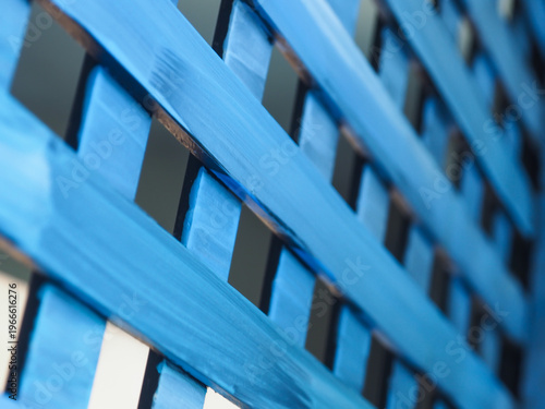 Abstract close-up of a blue wooden partition with elegant vertical lines. A versatile backdrop providing ample copy space for creative branding and lifestyle storytelling.