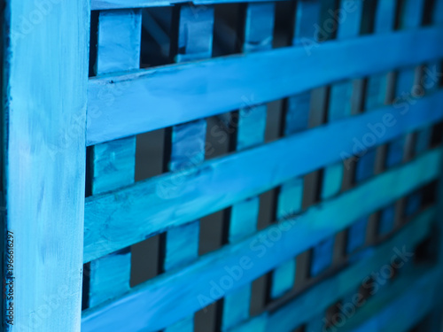 Abstract close-up of a blue wooden partition with elegant vertical lines. A versatile backdrop providing ample copy space for creative branding and lifestyle storytelling.