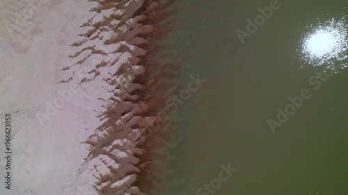 Aerial view of sadny coastline of the Mekong River.