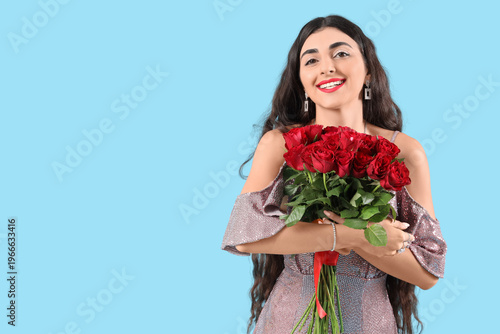Happy young woman with bouq...