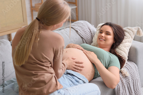 Young happy pregnant woman ...