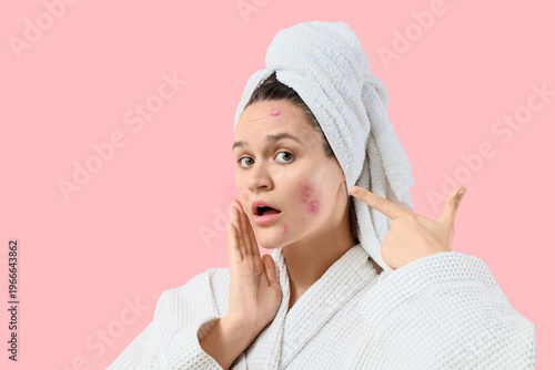 Shocked young woman in bath...