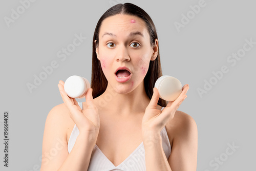 Shocked young woman with ac...