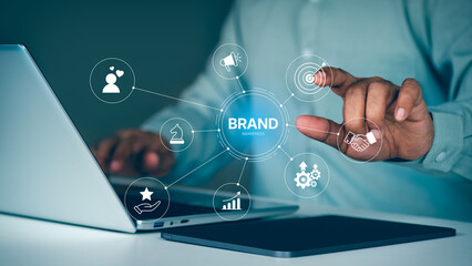 Brand awareness strategy concept, businessman touch digital brand awareness icons, communication, target, Marketing growth, customer loyalty, and partnership symbols for corporate branding success