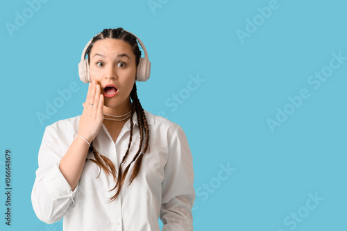 Shocked young woman with dr...