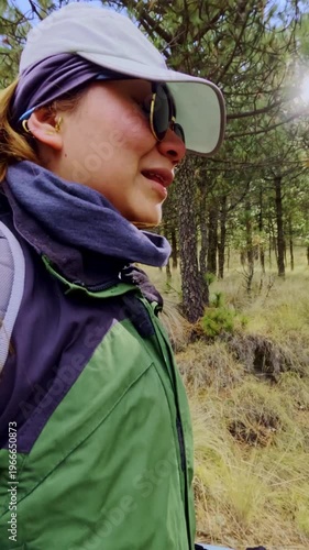 Adventurous woman hiking in a mexican forest near volcano iztaccihuatl