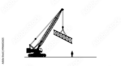 Construction crane lifting a steel girder dramatic black silhouette