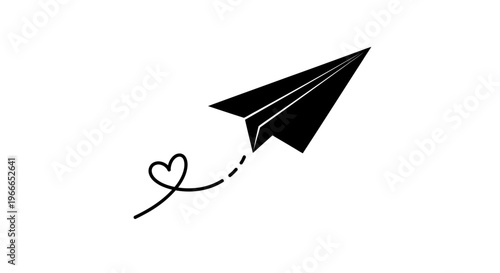 A black paper airplane flies with a heart trail a striking silhouette