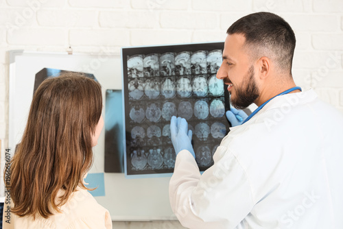 Male doctor showing MRI sca...