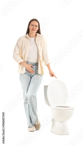 Young woman near toilet bow...