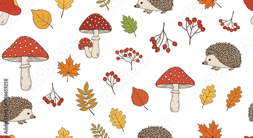 Cute autumnal pattern featuring small hedgehogs walking among red mushrooms falling leaves and orange berries on white background.