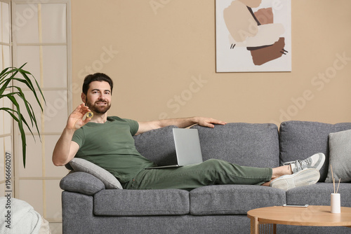 Handsome man with bitcoin a...