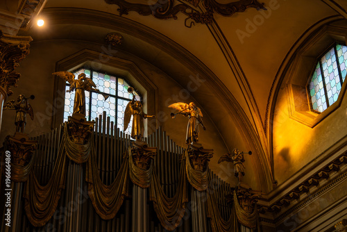 Dramatic view of the interior gallery under the dome of Monte Berico featuring statues of saints and circular windows in Vicenza, Italy 08.01.2026