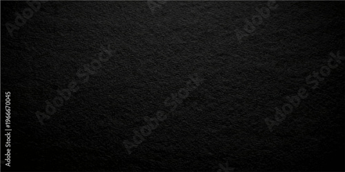 Textured black background, a study in contrasts, offering a versatile canvas for design. The rough, grainy surface plays with light and shadow, delivering a sense of depth and dimension.