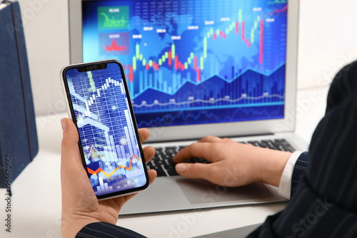 Female trader working with ...