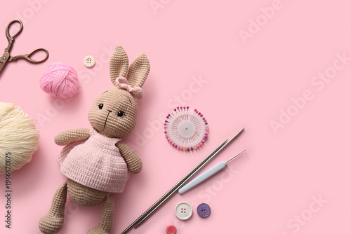 Knitted bunny toy with yarn...