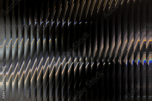 A close-up view of a metallic surface with a wavy pattern illustration