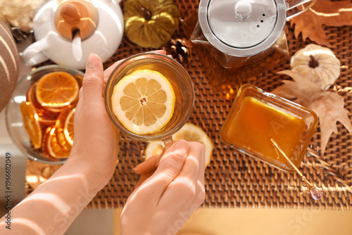 Female hands with cup of te...