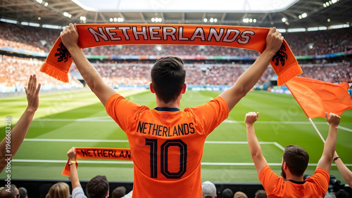Dutch fan in orange jersey waving Netherlands scarf at soccer match