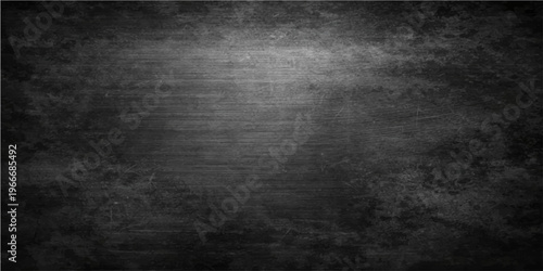 A dark abstract surface, showcasing a textured, weathered appearance. This evokes a sense of depth, with subtle gradations of light and shadow adding dimension and intrigue. 