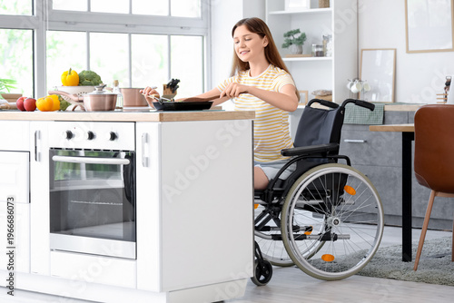 Young woman in wheelchair f...