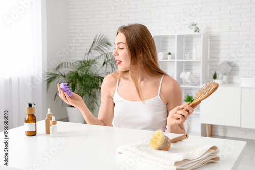 Young woman with hair scalp...