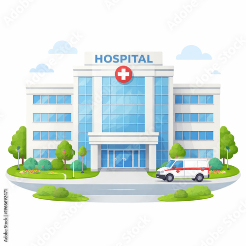 A modern, three-story hospital building with a clean white facade and large blue windows. The entrance features a red cross medical sign and a white ambulance parked out front. The facility is surroun