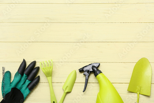 Gardening tools on yellow w...