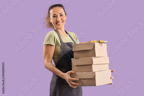 Happy female shoemaker with...