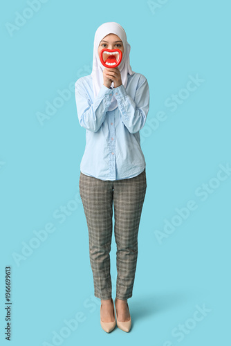 Young Asian Muslim woman wi...