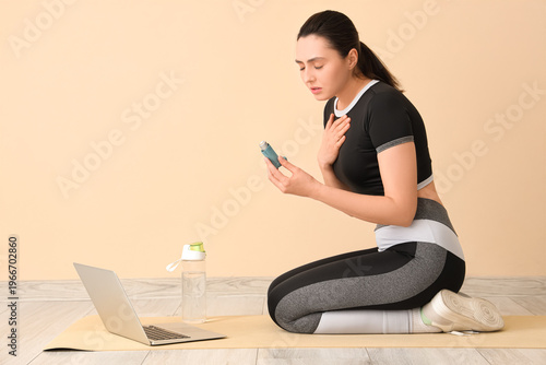 Sporty young woman with inh...