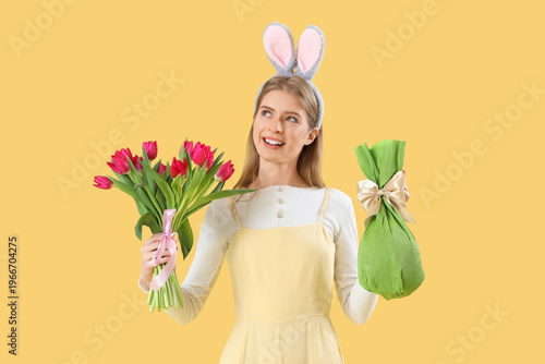Young woman in bunny ears w...