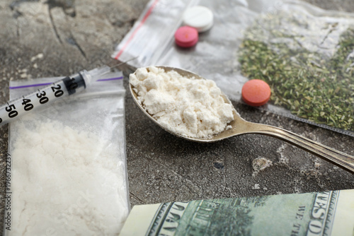 Spoon with drugs, syringe a...