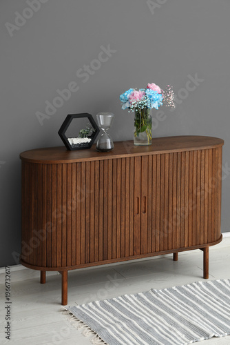Stylish wooden chest of dra...