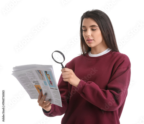 Young woman with magnifier ...