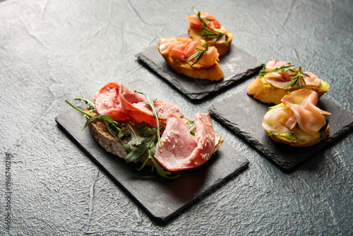 Slate plates of tasty brusc...
