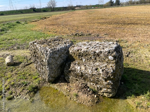Ancient Blocks in Landscape: weathered stone blocks stand as silent sentinels, revealing remnants of a forgotten past amidst the vast expanse of the landscape.