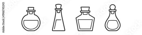 Collection of four stylized glass bottles with cork stoppers and liquid inside
