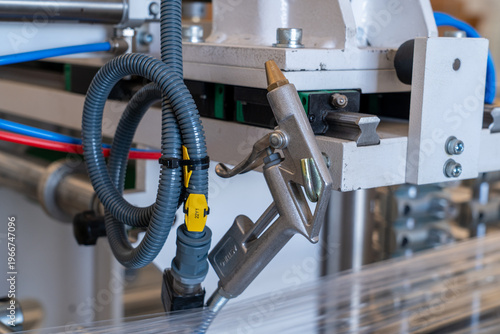 Tableau sur toile Industrial air blow gun hanging on manufacturing machine frame