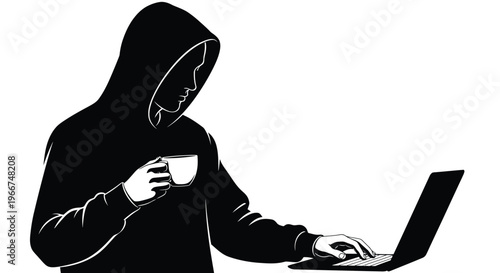 A hooded person typing on a laptop while holding a cup