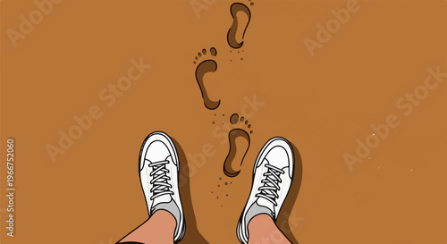 Footprints in the sand leading away from white sneakers