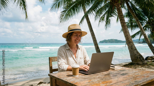 A person working remotely on a laptop by the beach with palm trees and a beautiful ocean view