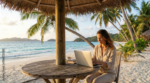 A person working remotely on a laptop by the beach with palm trees and a beautiful ocean view