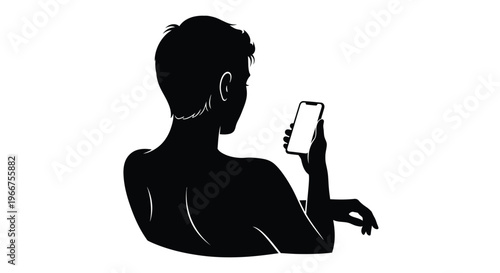 Silhouette of a man holding a smartphone in his hand looking at the screen intently alone