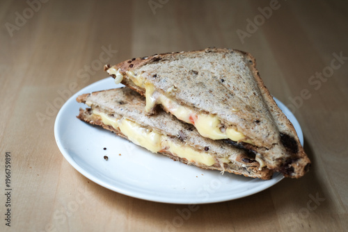 Homemade sandwich cheese and tuna on the white plate.