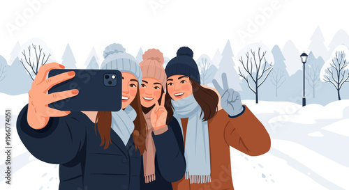 Three joyful friends taking a winter selfie outdoors, sharing a happy moment in the snow